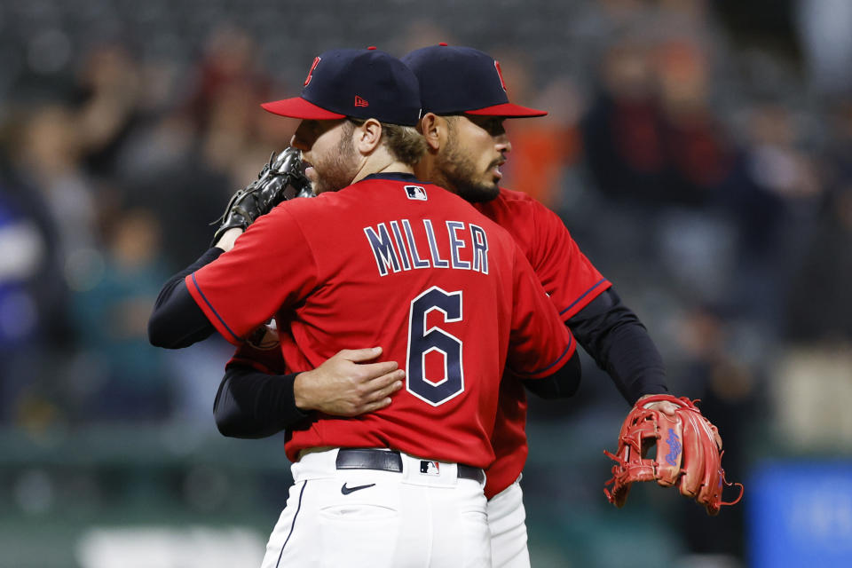 Cleveland Guardians first baseman Owen Miller (6) and third baseman Gabriel Arias celebrate a 5-3 win against the Kansas City Royals in a baseball game, Tuesday, Oct. 4, 2022, in Cleveland. (AP Photo/Ron Schwane)