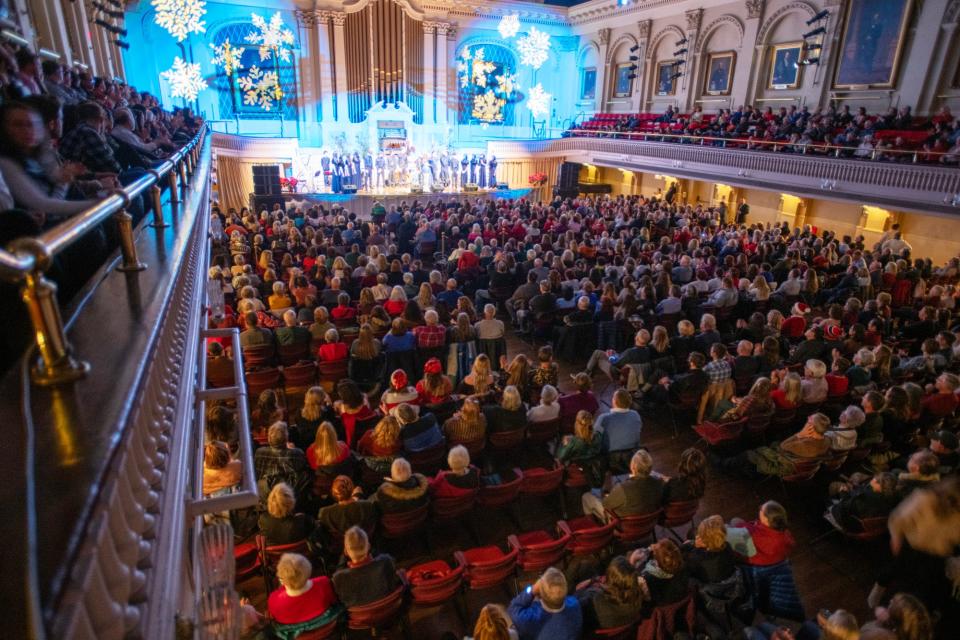 Cara Brindisi and the Shrewsbury High School Choir perform to a packed house at Mechanics Hall Friday.