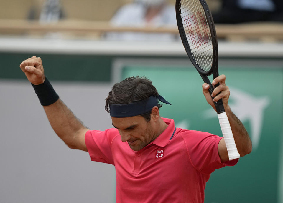 Switzerland's Roger Federer celebrates after defeating Croatia's Marin Cilic in their second round match on day 5, of the French Open tennis tournament at Roland Garros in Paris, France, Thursday, June 3, 2021. (AP Photo/Michel Euler)