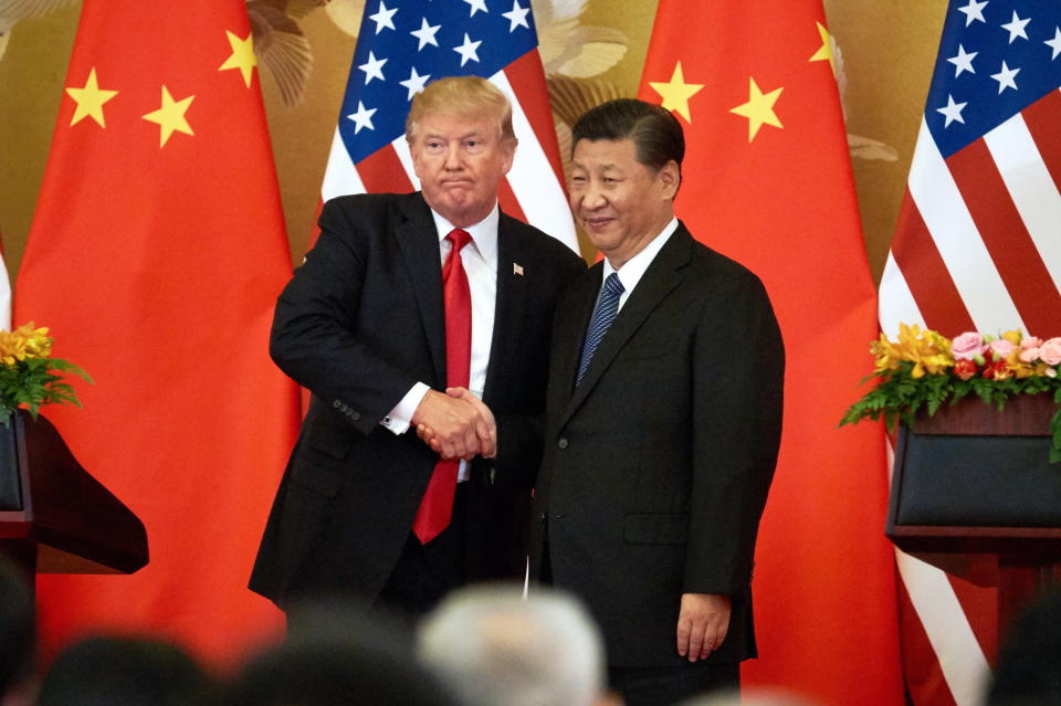 President Donald Trump and China's President Xi Jinping shake hands in Beijing on Nov. 9, 2017. (Photo: Artyom Ivanov via Getty Images)