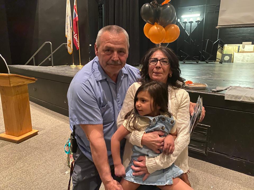 Steve Medeiros, along with his wife, Dina, and their granddaughter Quincy. On Wednesday, April 12, 2023, Taunton High School threw a giant retirement party for head custodian Steven Medeiros in the auditorium after school.