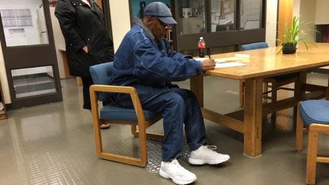 OJ Simpson signing forms before his release Sunday (Nevada Department of Corrections)