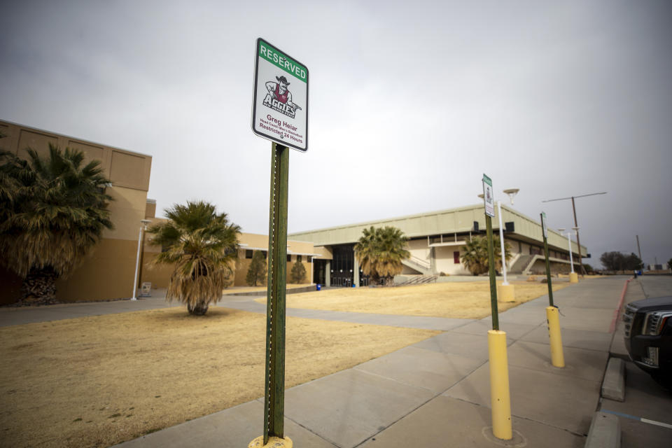 The parking spot for Greg Heiar, former New Mexico State University men's basketball coach, shows a reserved sign outside the Pan American Center, Wednesday, Feb. 15, 2023, in Las Cruces, N.M. (AP Photo/Andrés Leighton)