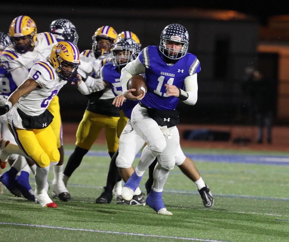 Whitesboro Quarterback, Kyle Meier, finds an opening on the first play of the game and breaks free from the pack scoring a touchdown during their semifinal game at Cicero-North Syracuse High School.