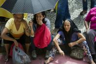 Brazil's economy is expected to contract by 3% this year, according to the IMF, as activists demand better housing during a rally in Sao Paulo, on October 5, 2015