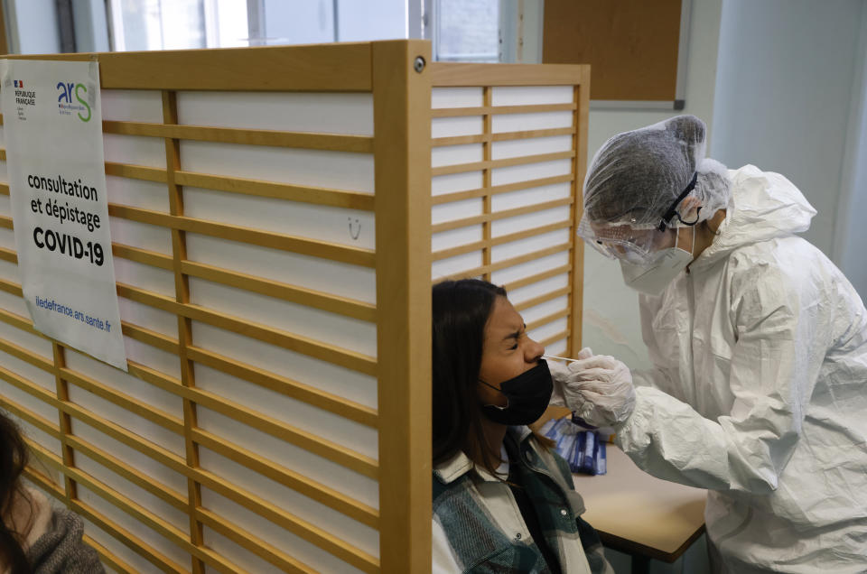 A student of the Emile Dubois high school takes part to a COVID-19 antigen test in Paris, Monday Nov. 23, 2020. Experts said they are less accurate than the standard PCR test, which detects even the tiniest genetic trace of the virus. Many governments including in France have started deploying them as a precursor to PCR tests.( Ludovic Marin, Pool via AP)