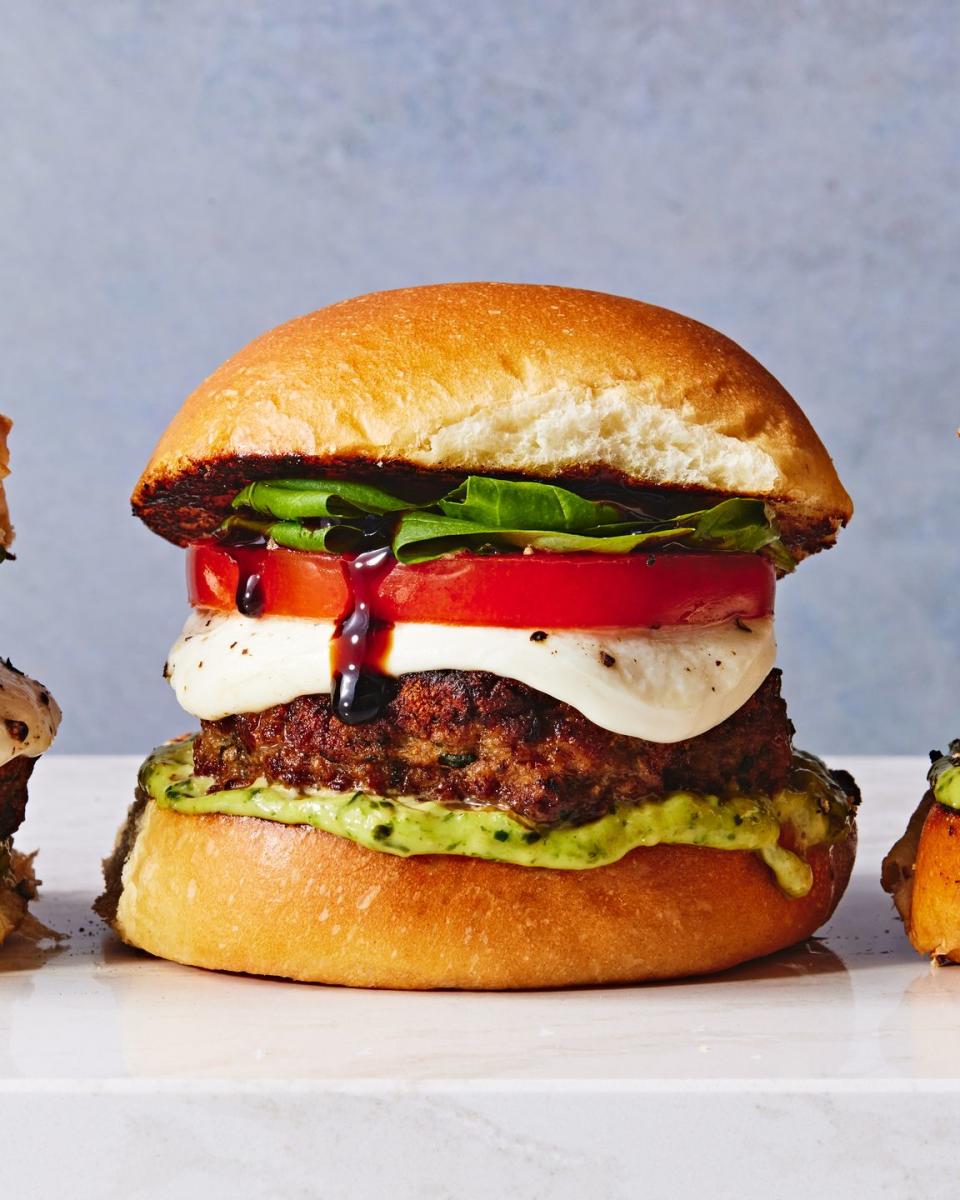 caprese turkey burgers topped with mozzarella, tomato, and basil