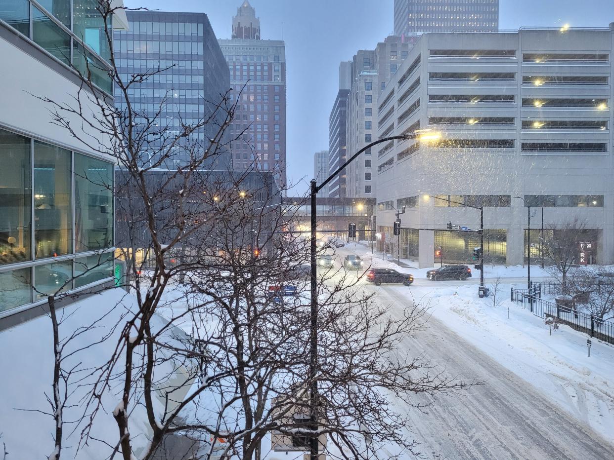 Roads in downtown Des Moines are covered with fresh snow as rush hour begins Thursday, Jan. 18, 2024.