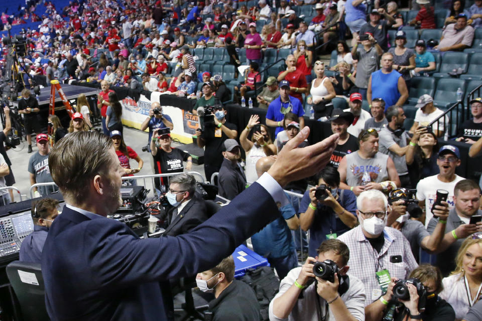 Eric Trump, the son of President Donald Trump, waves to supporters before a rally in Tulsa, Okla., Saturday, June 20, 2020. (AP Photo/Sue Ogrocki)