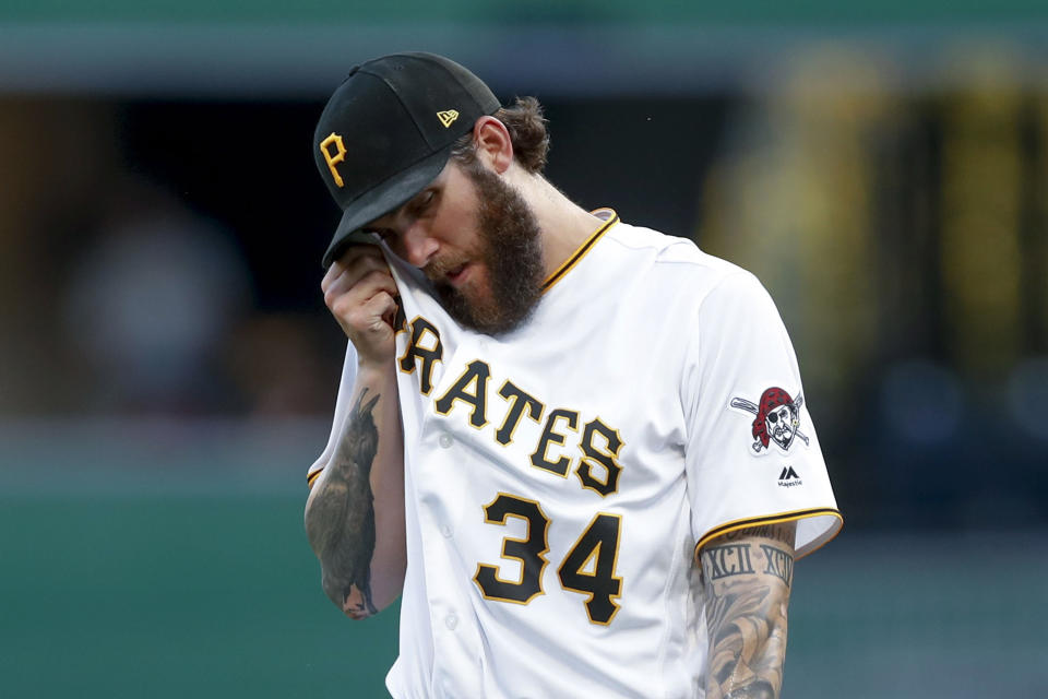 Pittsburgh Pirates starting pitcher Trevor Williams wipes his face after walking Washington Nationals' Juan Soto in the first inning of a baseball game, Monday, Aug. 19, 2019, in Pittsburgh. (AP Photo/Keith Srakocic)