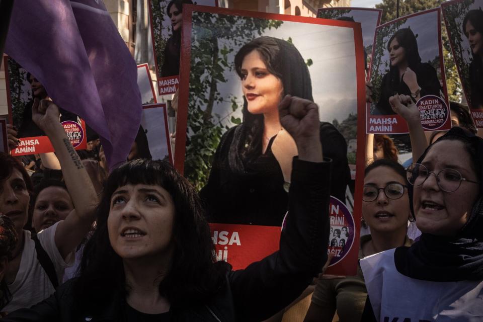 Women hold signs and chant slogans during a protest over the death of Iranian Mahsa Amini outside the Iranian Consulate on September 29, 2022 in Istanbul, Turkey. Mahsa Amini fell into a coma and died after being arrested in Tehran by the morality police, for allegedly violating the countries hijab rules. Amini's death has sparked weeks of violent protests across Iran.