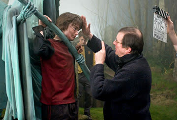 <p>Daniel Radcliffe and director Mike Newell on the set of Warner Bros. Pictures' Harry Potter and the Goblet of Fire - 2005</p>