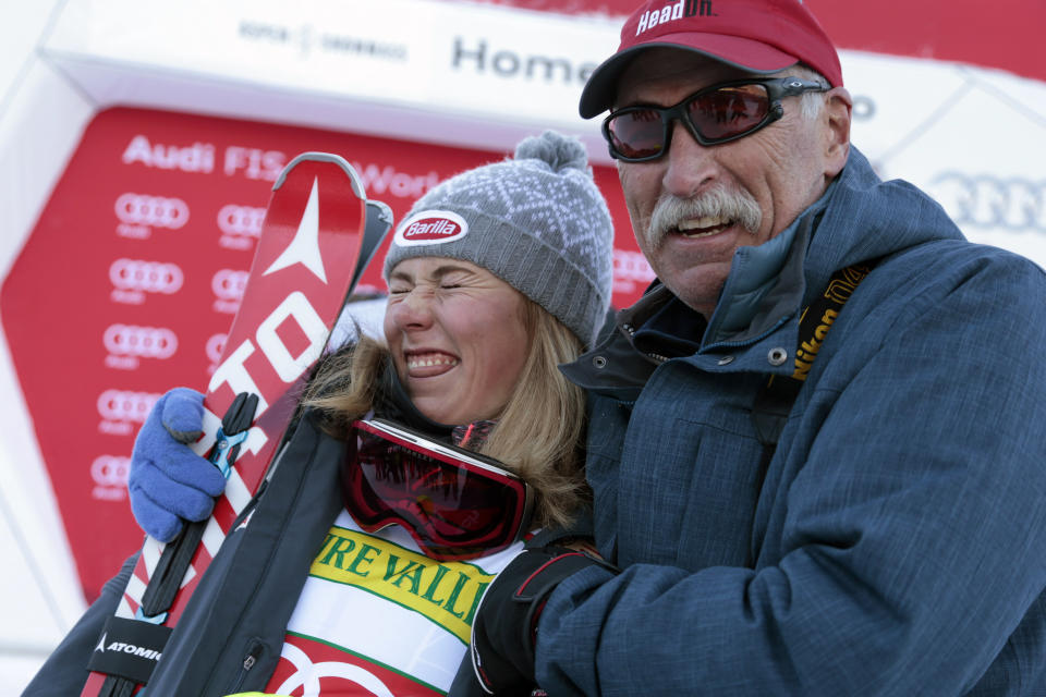 FILE - First-place finisher Mikaela Shiffrin, left, poses with her father Jeff Shiffrin after the women's World Cup slalom ski race in Aspen, Colorado, on Nov. 28, 2015. Mikaela Shiffrin has had a World Cup skiing career like no other woman. Shiffrin raced to a record-breaking 83rd win Tuesday. Mikaela Shiffrin has had a World Cup skiing career like no other woman. Shiffrin raced to a record-breaking 83rd win Tuesday, Jan. 24, 2023. (AP Photo/Nathan Bilow, File)