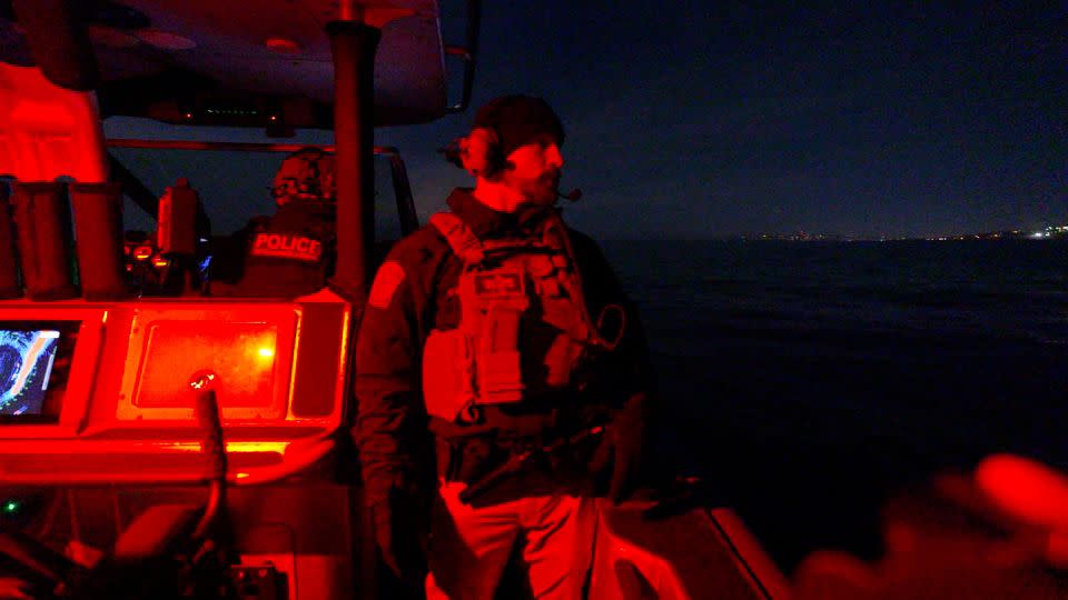 Kurt Nagel of CBP's Air and Marine Operations scans the ocean for anything suspicious. - CNN