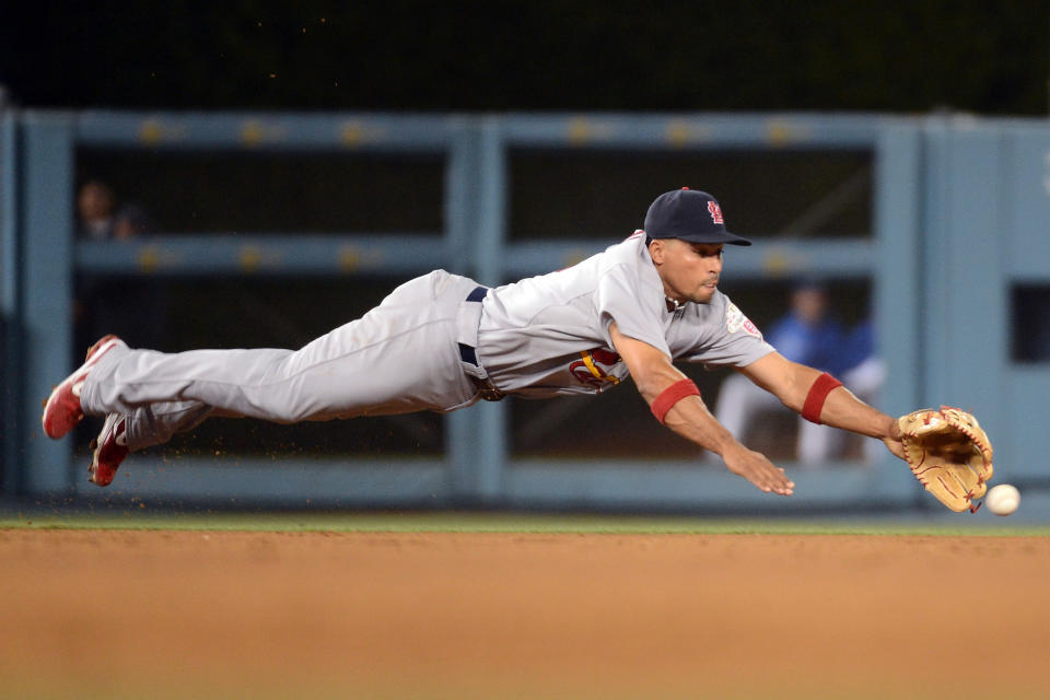 LOS ANGELES, CA - MAY 18: Rafael Furcal #15 of the St. Louis Cardinals dives after a ball hit by Tony Gwynn #10 of the Los Angeles Dodgers during the fourth inning at Dodger Stadium on May 18, 2012 in Los Angeles, California. (Photo by Harry How/Getty Images)