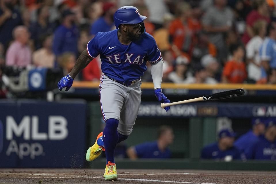 Texas Rangers' Adolis Garcia hits an RBI single during the first inning of Game 6 of the baseball AL Championship Series against the Houston Astros Monday, Oct. 23, 2023, in Houston. (AP Photo/David J. Phillip)