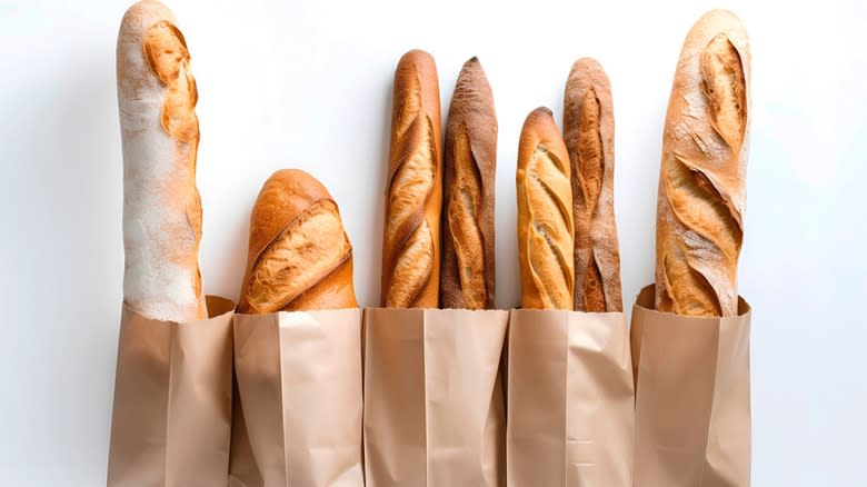 Baguettes in brown paper bags