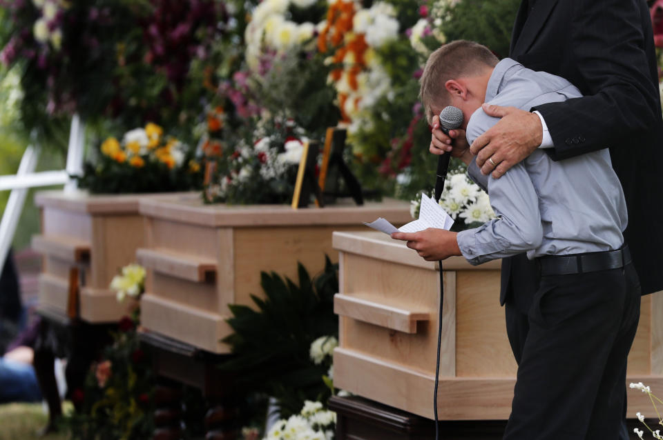 A boy pauses as he speaks next to the coffins of Dawna Ray Langford, 43, and her sons Trevor, 11, and Rogan, 2, who were killed by drug cartel gunmen, during the funeral at a family cemetery in La Mora, Sonora state, Mexico, Thursday, Nov. 7, 2019. Three women and six of their children, all members of the extended LeBaron family, died when they were gunned down in an attack while traveling along Mexico&#39;s Chihuahua and Sonora state border on Monday. (AP Photo/Marco Ugarte)