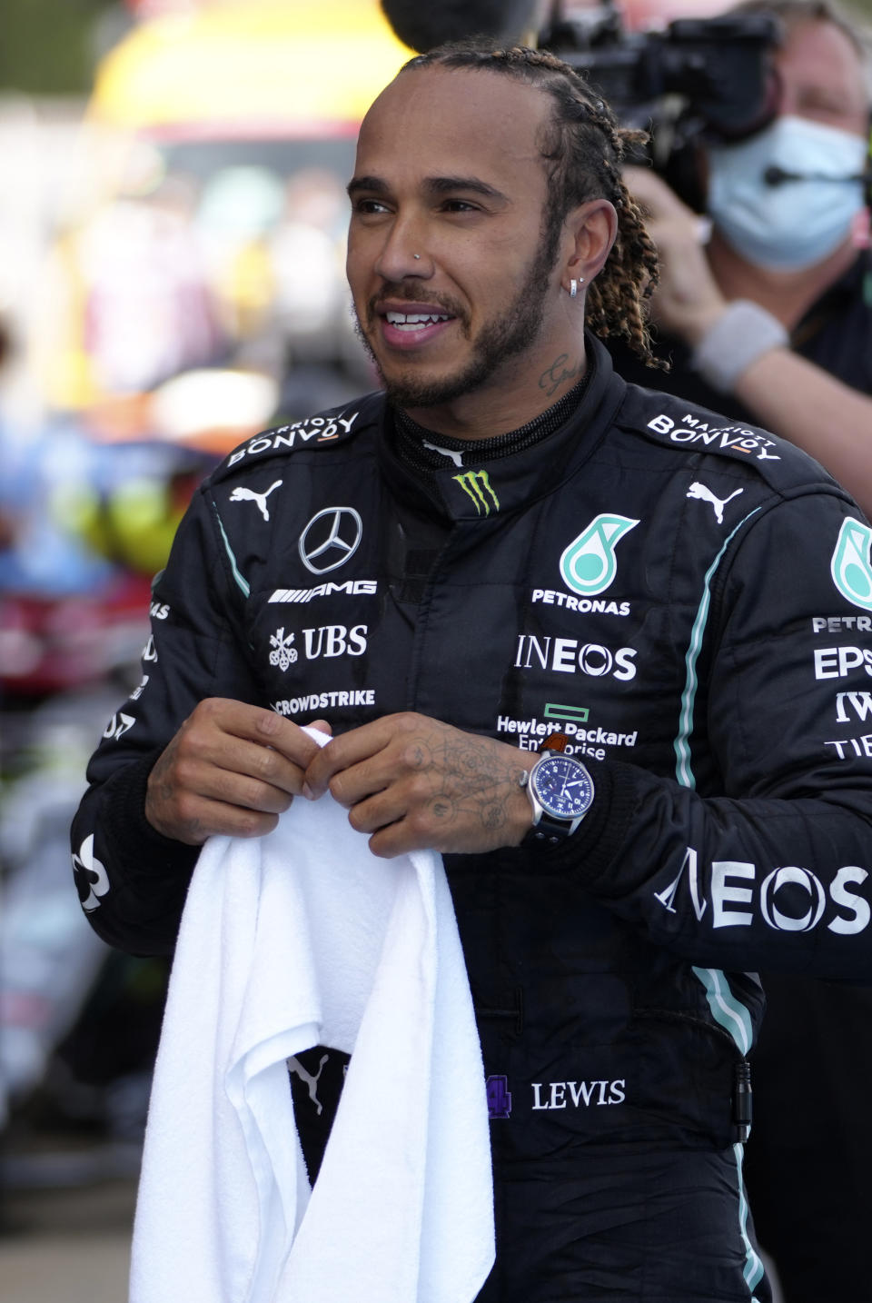 Mercedes driver Lewis Hamilton of Britain smiles after winning the Spanish Formula One Grand Prix at the Barcelona Catalunya racetrack in Montmelo, just outside Barcelona, Spain, Sunday, May 9, 2021. (AP Photo/Emilio Morenatti, Pool)