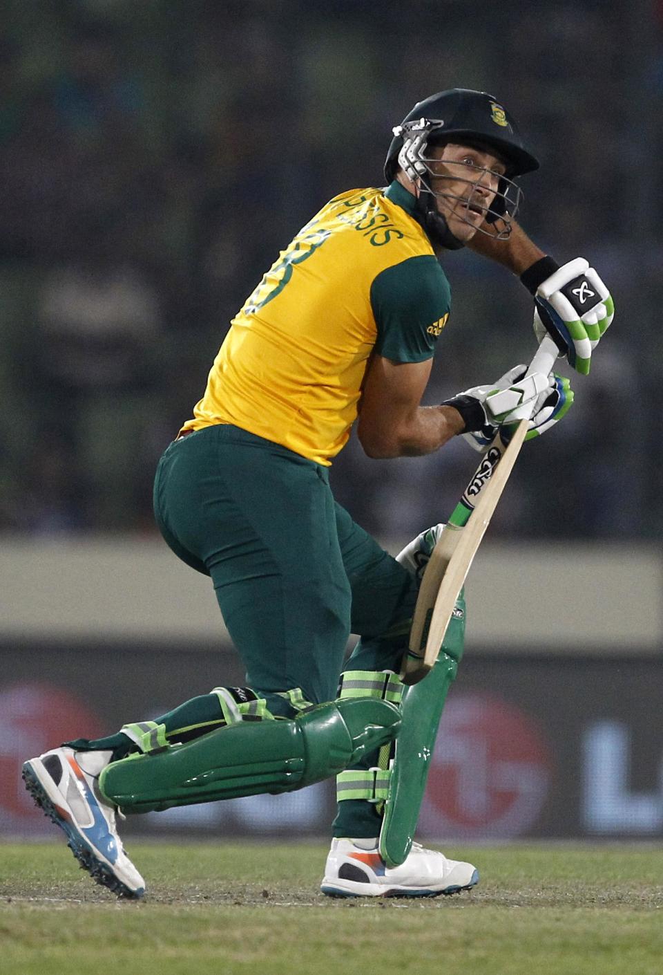 South Africa's captain Francois du Plessis plays a shot during their ICC Twenty20 Cricket World Cup semifinal match against India in Dhaka, Bangladesh, Friday, April 4, 2014.(AP Photo/A.M. Ahad)