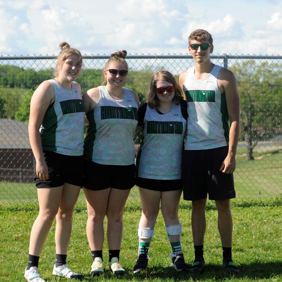 Brooke Hopkins posing with her teammates Karlee Uhrig, Alizia Malone, and Nick Marion at the SVC Track Meet.