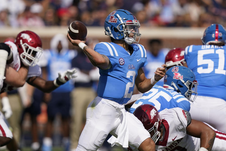 Mississippi quarterback Matt Corral (2) passes against Arkansas during the first half of an NCAA college football game, Saturday, Oct. 9, 2021, in Oxford, Miss. Mississippi won 52-51. (AP Photo/Rogelio V. Solis)