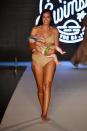 <p>Model Mara Martin walks the runway breastfeeding her baby for the 2018 <em>Sports Illustrated</em> swimsuit show during the Paraiso Fashion Fair in Miami at the W South Beach hotel on July 15. (Photo: Alexander Tamargo/Getty Images for Sports Illustrated) </p>