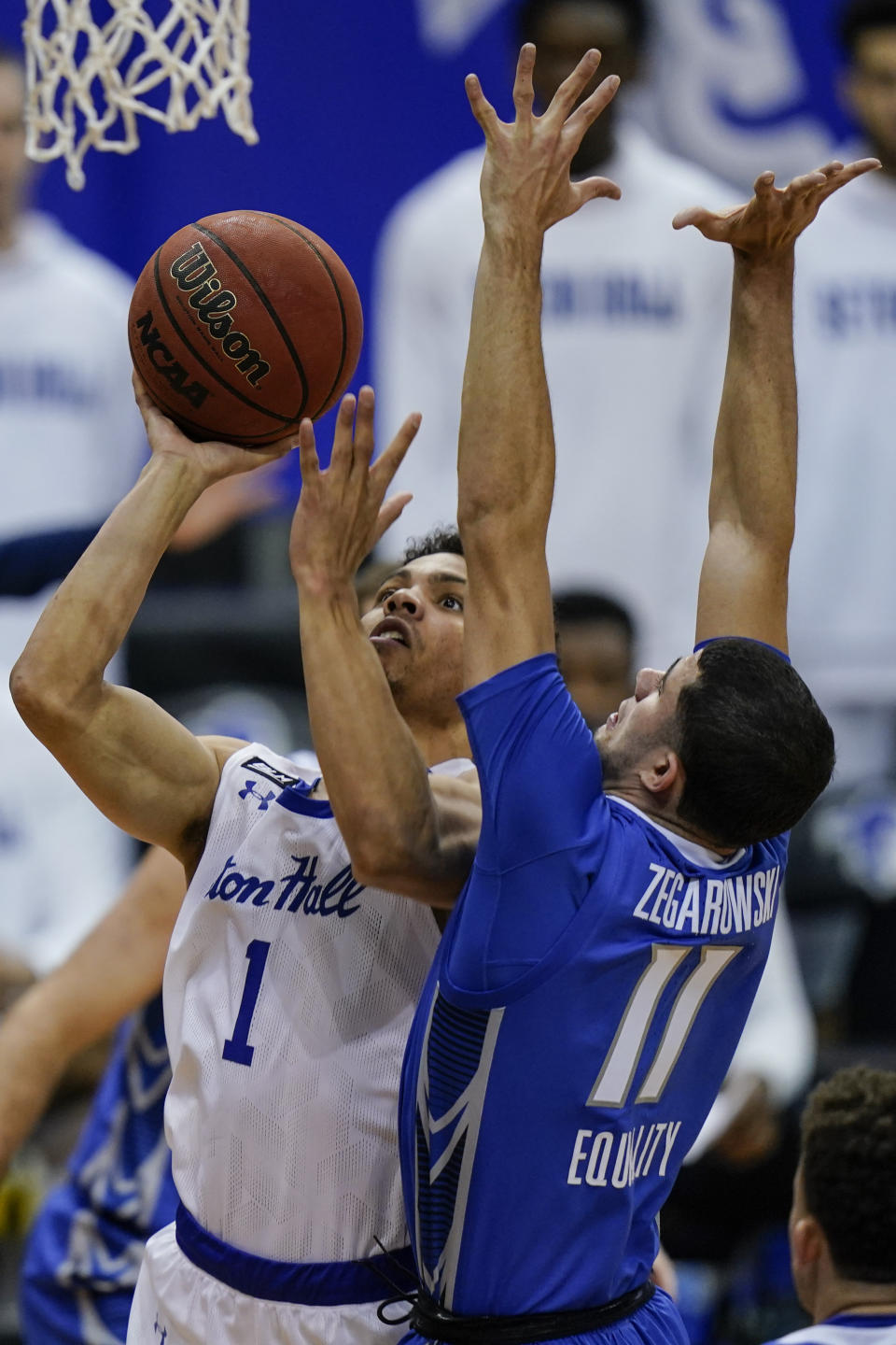 Seton Hall's Bryce Aiken (1) drives past Creighton's Marcus Zegarowski (11) during the second half of an NCAA college basketball game Wednesday, Jan. 27, 2021, in Newark, N.J. Creighton won 85-81. (AP Photo/Frank Franklin II)