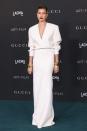 <p>Hailey Bieber gave us a lesson in pared-back red carpet glamour in a simple white column dress, featuring shoulder pads and a deep v-neck, by Saint Laurent to the LACMA Art + Film Gala. The 24-year-old paired the maxi dress with gold bangles and wore a deep red lip. </p>