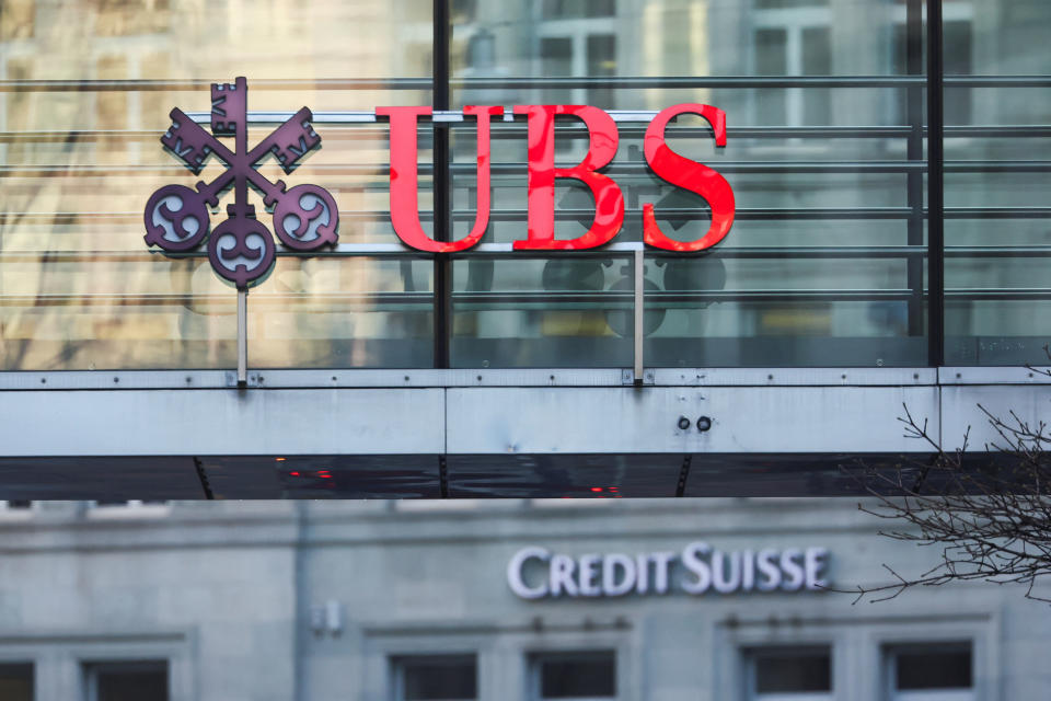 Logos of Swiss banks UBS and Credit Suisse are seen in Zurich, Switzerland March 20, 2023. REUTERS/Denis Balibouse