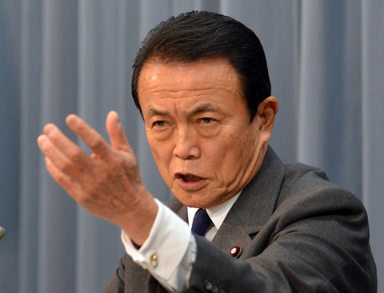 Japanese Finance Minister Taro Aso speaks at a press conference in Tokyo, on Janaury 15, 2013. Japan logged a $7.2 billion trade deficit in December, bringing the total trade gap to a record $78 billion for 2012, official data showed on Thursday