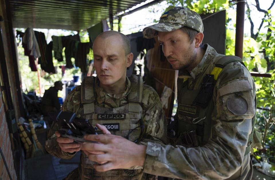 Ukrainian servicemen correct artillery fire by drone at the frontline near Kharkiv, Ukraine, in July 2022. (AP Photo/Evgeniy Maloletka)