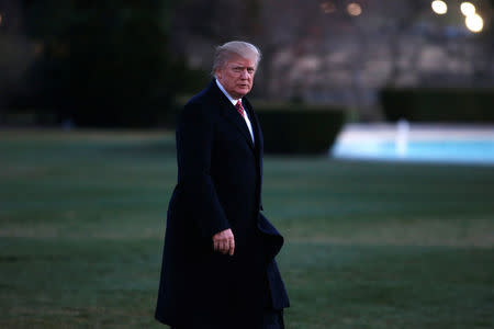 U.S. President Donald Trump walks from Marine One as he returns to the White House in Washington. REUTERS/Joshua Roberts