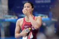 Margaret MacNeil of Canada leaves the pool after winning the final of the women's 100-meter butterfly at the 2020 Summer Olympics, Monday, July 26, 2021, in Tokyo, Japan. (AP Photo/Martin Meissner)