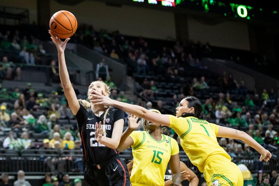 Oregon forward Kennedy Basham fouls Stanford forward Cameron Brink as the Oregon Ducks host the No. 4 Stanford Cardinal Saturday, March 2, 2024, at Matthew Knight Arena in Eugene, Ore.