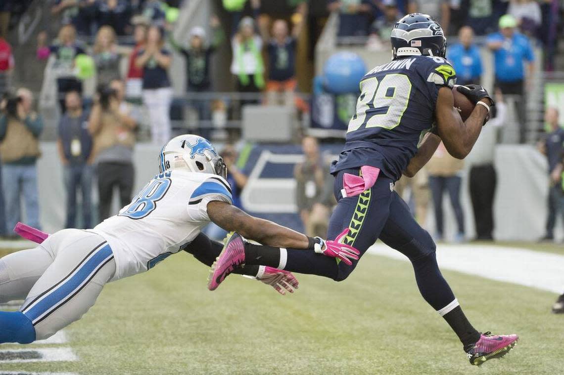 Seahawks wide receiver Doug Baldwin pulls in a touchdown pass over Lions cornerback Quandre Diggs during the Monday Night Football game at CenturyLink Field in Seattle on Oct 5, 2015