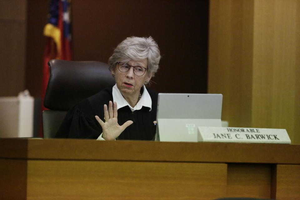 Judge Jane C. Barwick speaks during a bond hearing for former Atlanta police officer Garrett Rolfe who appears on a television screen on Tuesday, June 30, 2020, in Atlanta. Rolfe, who fatally shot Rayshard Brooks can be free on bond while his case is pending. A judge set a bond of $500,000 for Rolfe, who faces charges including felony murder in the killing of the 27-year-old Black man. Rolfe fatally shot Brooks in the back when Brooks fired a Taser in his direction while running away after a struggle on June 12. (AP Photo/Brynn Anderson, Pool)