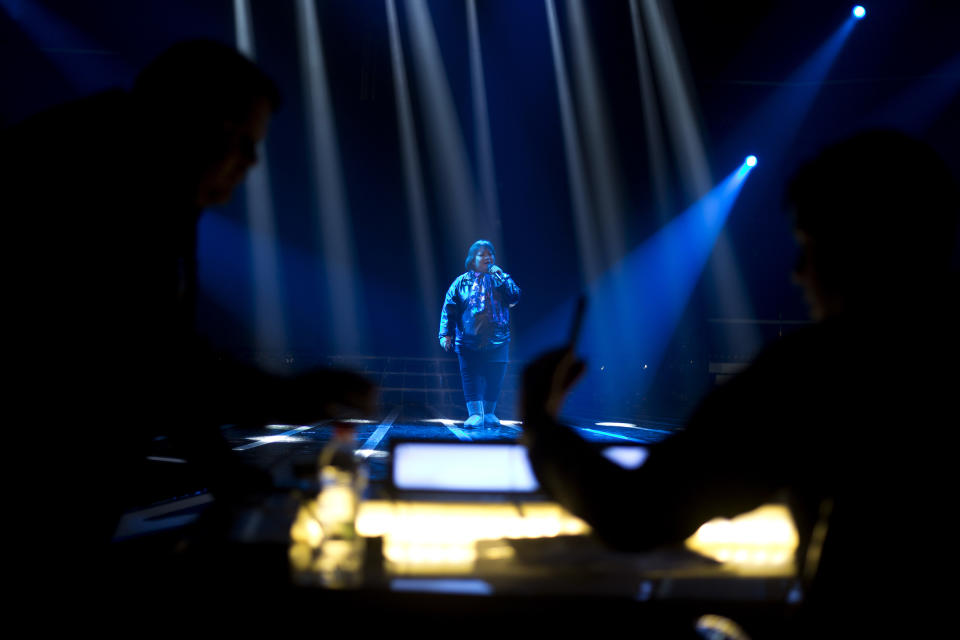 In this Wednesday, Jan. 1, 2014 photo, Rose Fostanes sings during a rehearsal of the X-Factor Israel in Tel Aviv. The 47-year-old Filipino caregiver has emerged as the newest star of Israeli reality television, putting a human face on the thousands of foreign workers who toil away in menial, back-breaking jobs in this country. (AP Photo/Ariel Schalit)