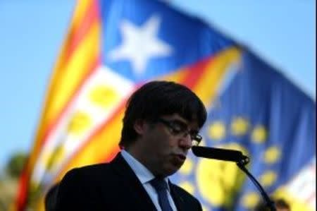 Catalan President Carles Puigdemont delivers a speech at the memorial of "Fossar de la Pedrera" (Pedrera mass grave) in Barcelona, Spain, October 15, 2017. REUTERS/Ivan Alvarado