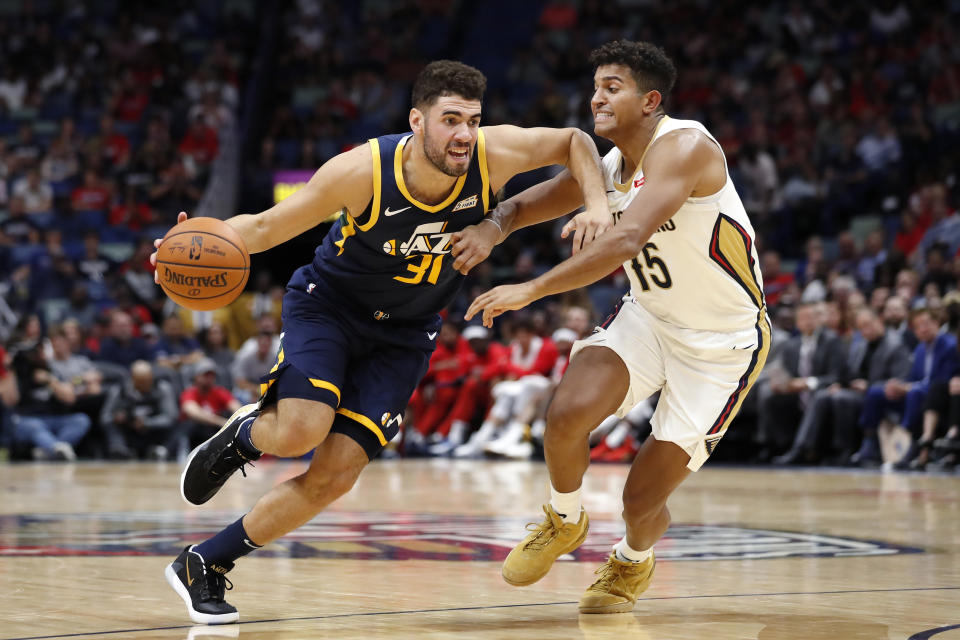 Utah Jazz forward Georges Niang (31) drives past New Orleans Pelicans guard Frank Jackson (15) during the second half of a preseason NBA basketball game in New Orleans, Friday, Oct. 11, 2019. (AP Photo/Tyler Kaufman)