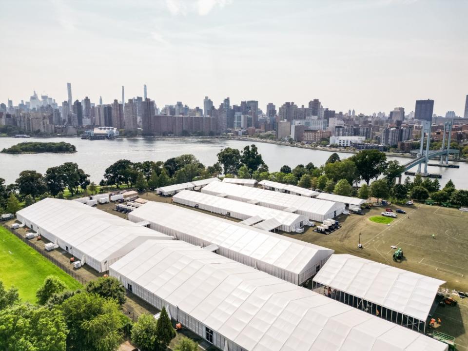 The migrant tent city at Randall’s Island has been a source of trouble for the NYPD, including a fatal stabbing in January.