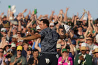 Scottie Scheffler celebrates after winning the 86th Masters golf tournament on Sunday, April 10, 2022, in Augusta, Ga. (AP Photo/Charlie Riedel)