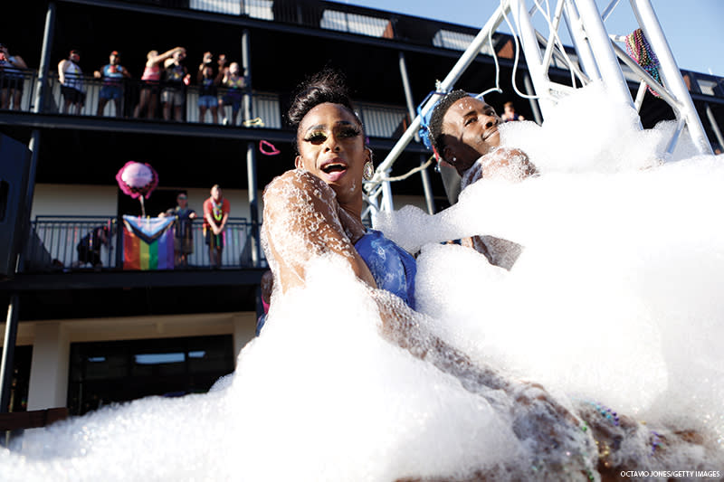 Revelers on Pride in foam