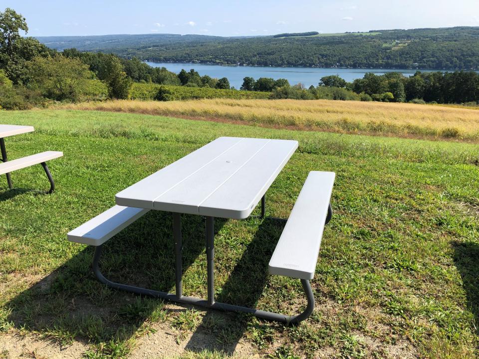 Visitors to Divided Sky Vineyard are welcome to enjoy a picnic and the views of Keuka Lake with their wines.