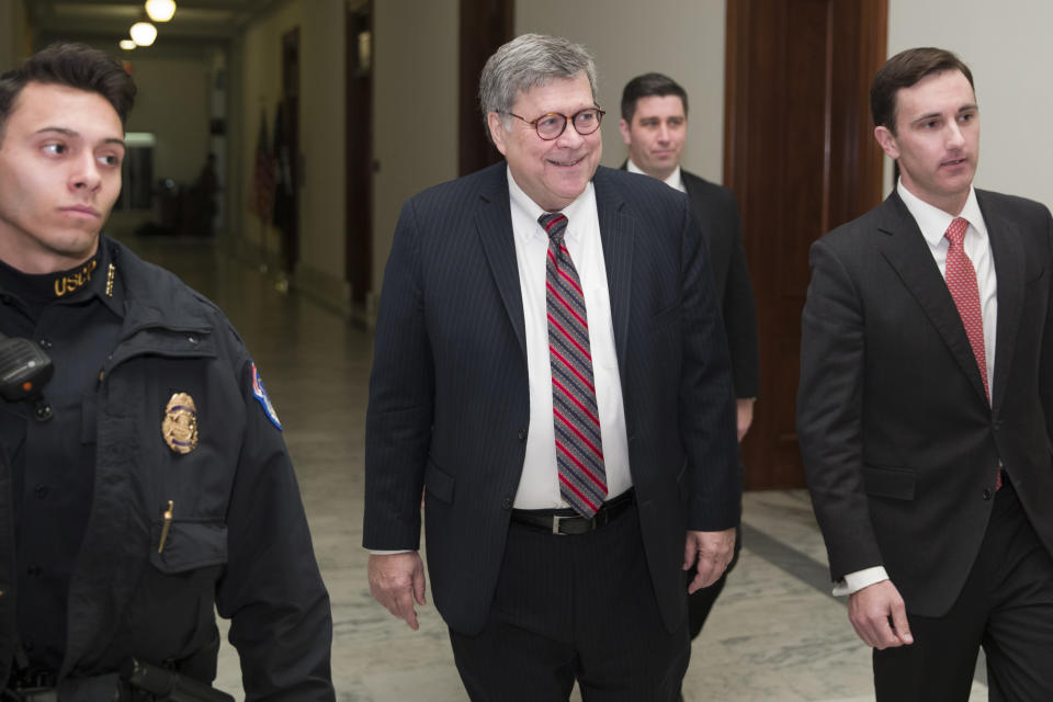 Attorney General nominee William Barr , center, arrives to meet with Sen. Ben Sasse, R-Neb., on Capitol Hill, Wednesday, Jan. 9, 2019 in Washington. (AP Photo/Alex Brandon)