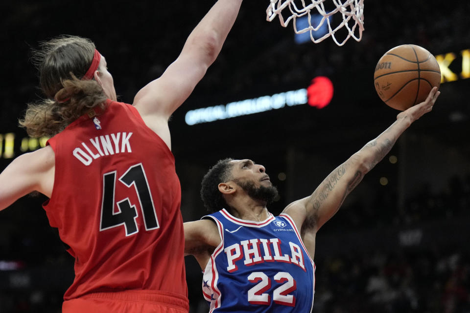 Philadelphia 76ers guard Cameron Payne (22) shoots as Toronto Raptors forward Kelly Olynyk (41) defends during the second half of an NBA basketball game Sunday, March 31, 2024, in Toronto. (Frank Gunn/The Canadian Press via AP)