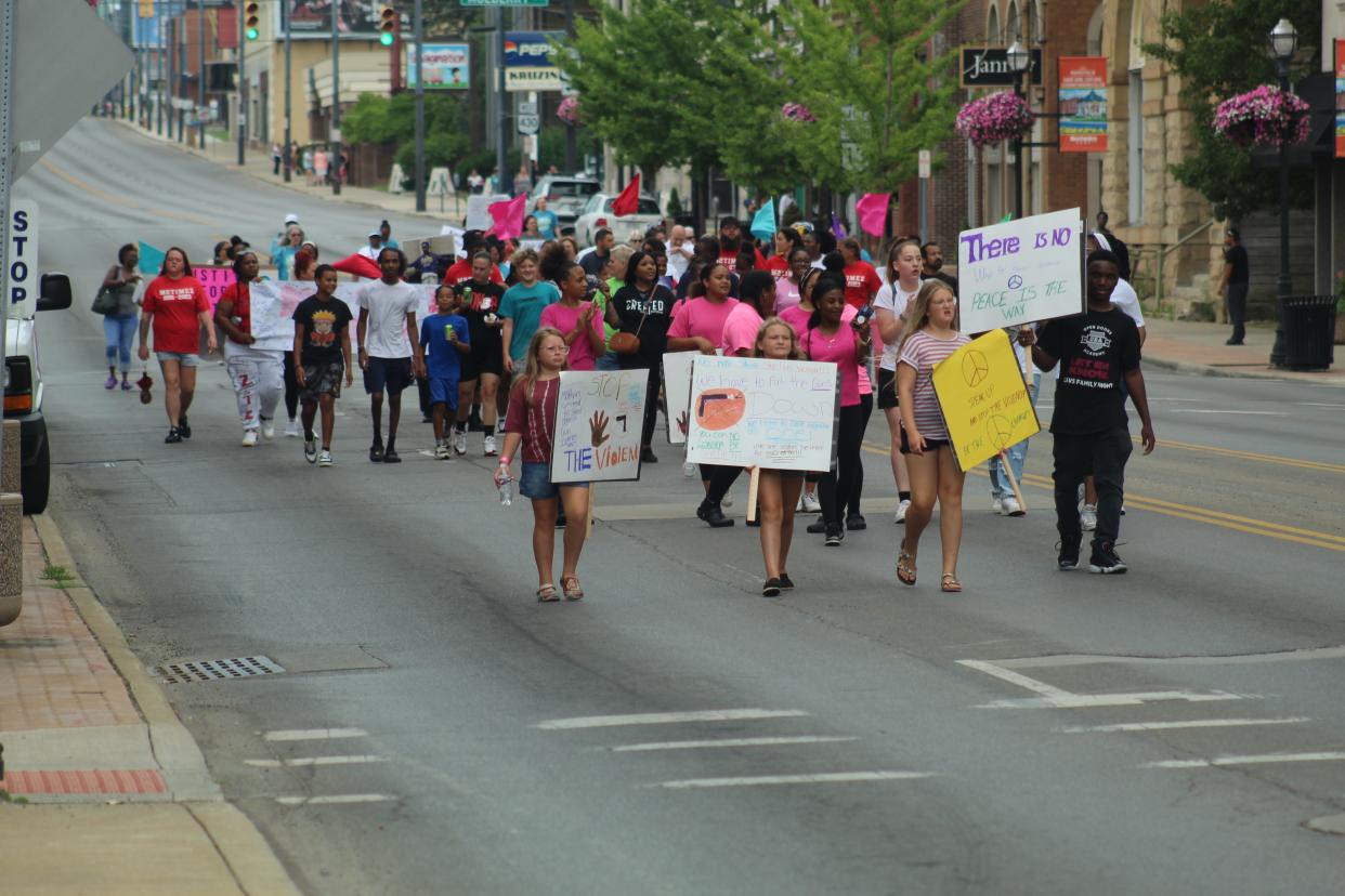 A peace march took place in downtown Mansfield on Saturday afternoon honoring Kay Day and pushing to end the recent violence in Mansfield.