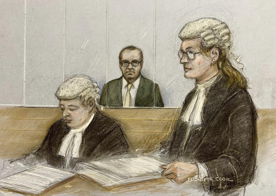 Court artist sketch by Elizabeth Cook of actor Kevin Spacey, center, in the dock as he listens to Christine Agnew KC, right, at Southwark Crown Court, London, Friday, June 30, 2023. Spacey is going on trial on charges he sexually assaulted four men as long as two decades ago. The double-Oscar winner faces a dozen charges at Southwark Crown Court. Spacey pleads not guilty to all charges. (Elizabeth Cook/PA via AP)