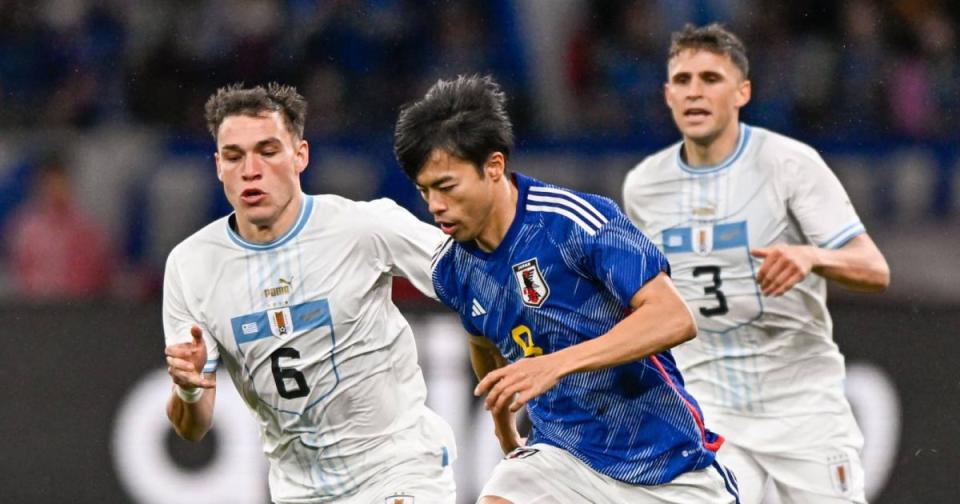 Uruguay midfielder Manuel Ugarte and Japan winger Kaoru Mitoma Credit: Alamy