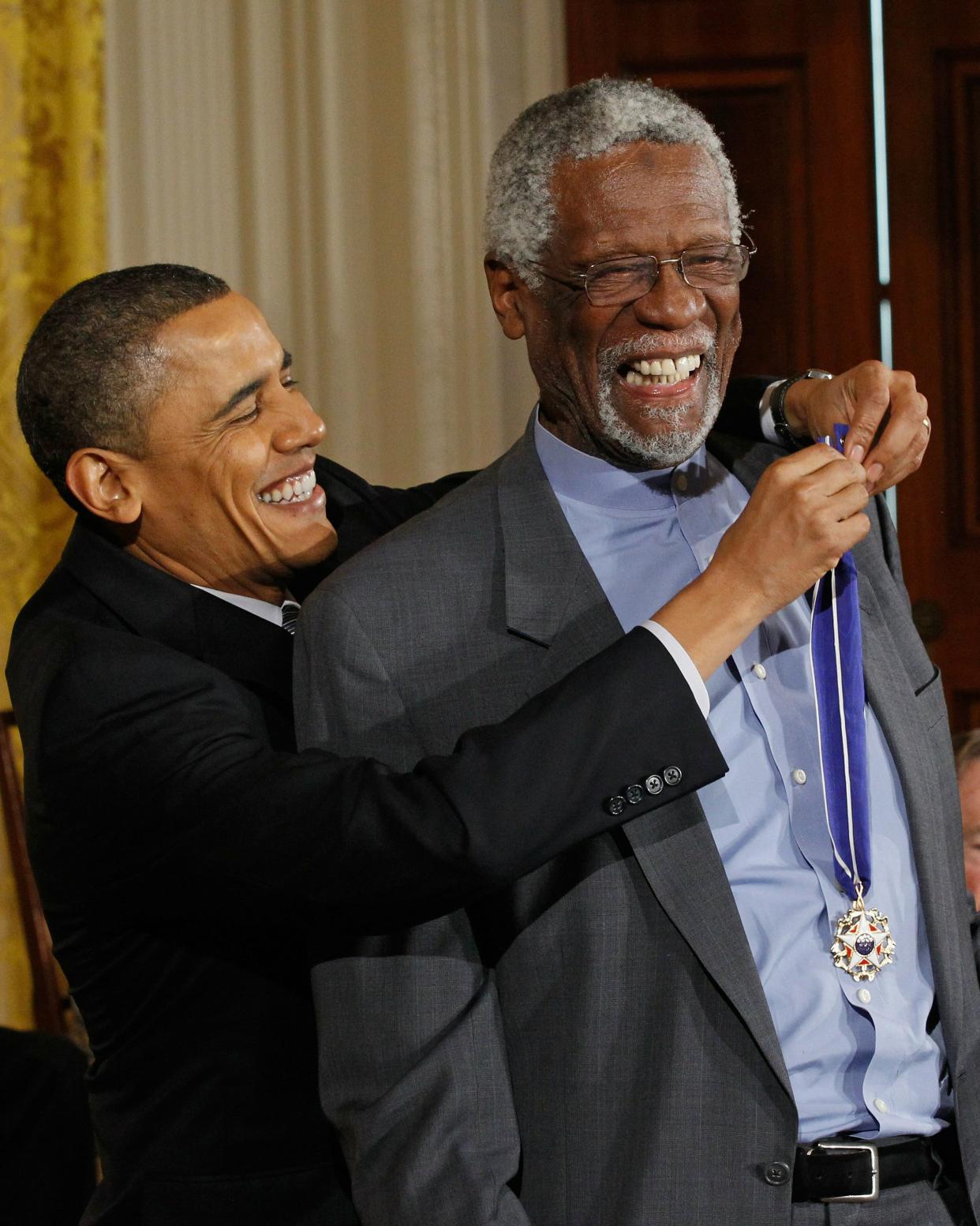 U.S. President Barack Obama (left) presents Bill Russell with the 2010 Medal of Freedom.